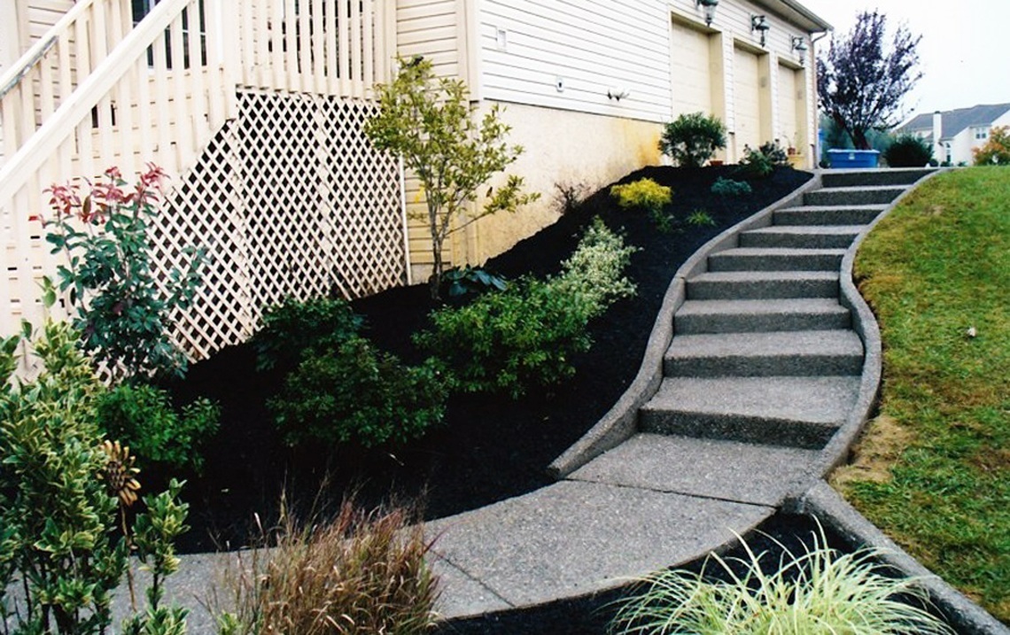 concrete steps integrated into landscaping